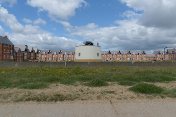 Martello tower at Felixstowe with many houses behind