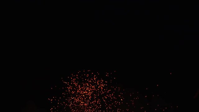 fire sparks from campfire over black background