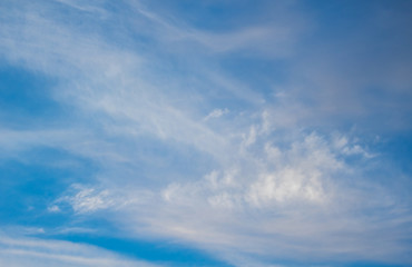 Naklejka na ściany i meble Blue boundless sky with the fluffy white clouds