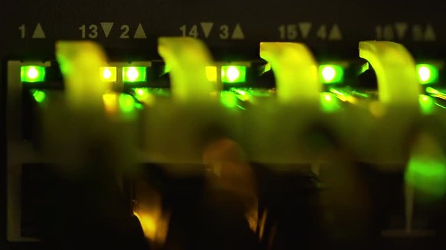 macro of lights blinking from a server Ethernet switch 4k.