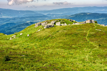 huge stones in valley on top of mountain range at sunrise