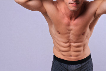 Body Waxing For Man . Attractive male body , Muscular torso, Chest and armpit hair removal close up.