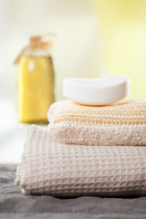 Fototapeta na wymiar spa towels and aromatic massage oil