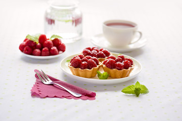 Fruit raspberry tarts on a table