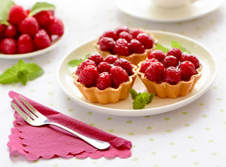 Fruit raspberry tarts on a table