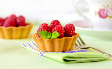 Fruit raspberry tarts on a table