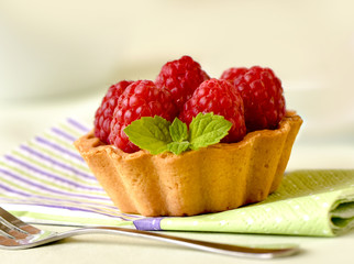 Fruit raspberry tarts on a table