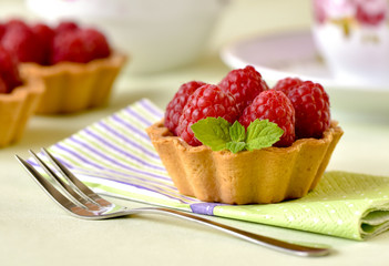 Fruit raspberry tarts on a table
