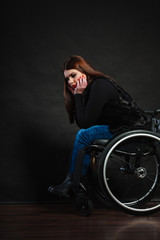 Naklejka na ściany i meble Sad girl on wheelchair.