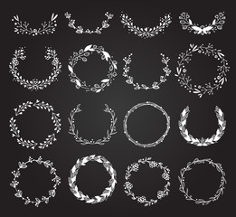 Hand drawn wreath set made in vector. Leaves and flowers garlands wreath hand drawn romantic floral design elements. Wreath hand drawn calligraphic decoration holiday frame floral silhouette.