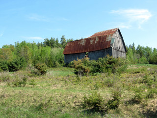 Weathered, abandoned barn from days gone by.