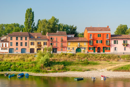 Colored houses along the south bank of river Ticino in Pavia, in the district called "Borgo Ticino"