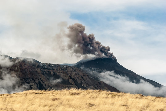 Ash emission from the South-East crater on volcano Etna after the end of a paroxysm on 4 December 2015