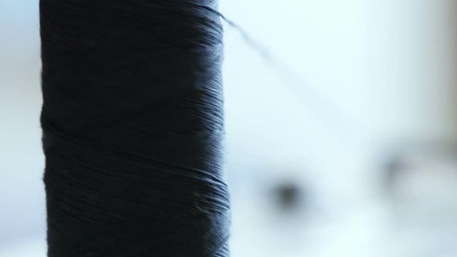  spool of sewing thread on the sewing machine, close-up