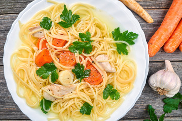 Classic chicken soup with noodles and vegetables