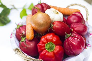 Basket with different vegetable  on simple white background
