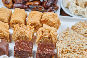 Oriental sweets on a white plate. Turkish or greek delight