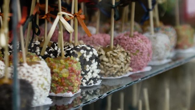 Close-up of tray of assorted variety of candy apples at state fair