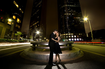 Los Angeles nightlife with an interracial dating couple on a busy downtown street at night. © Innovated Captures