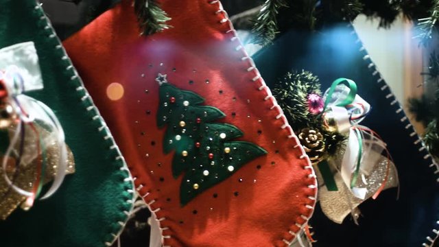Close up of christmas stockings in front of out of focus Christmas tree