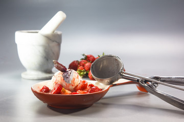 Ice cream with strawberries, spices and Basil.