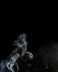 Fototapeta premium Abstract blue smoke from aromatic sticks.