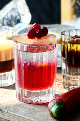 Set of alcoholic cocktail consisting of B-52, the pupil of a Nazi and boyarsky in glasses on a wooden table