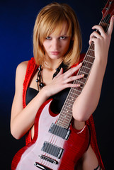 Woman with red electric guitar 
