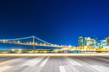 empty floor with cityscape and skyline of downtown near bay brid