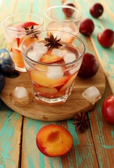 slivovitz (plum brandy) with ice and fresh plums 