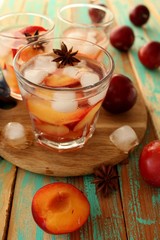 slivovitz (plum brandy) with ice and fresh plums 