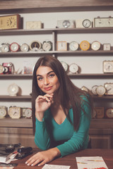 Smilling woman near the table