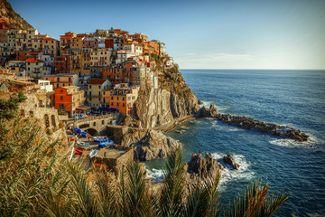 A film-like view over Manarola, one of the five famous villages that form Cinque Terre, with a special a Kodachrome emulation colour grading. Two other colour grading versions are available