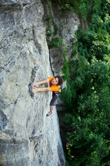 male rock climber. rock climber climbs on a rocky wall.