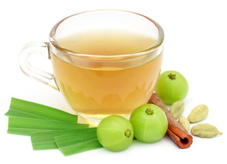 Herbal tea in a cup with different herbs