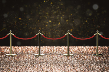 red carpet with rope barrier on glitter background