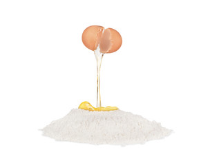 yolk falls into flour on white