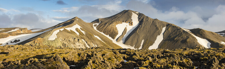 panorama with sun lights on the mountains tops in Iceland