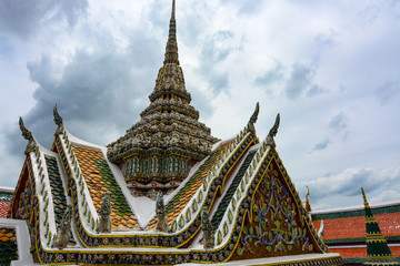 Fototapeta premium Ornate roof and spire at the historic Grand Palace in Bangkok, Thailand