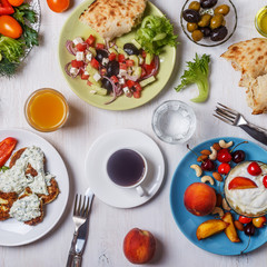Greek appetizers  - fritters of zucchini, Greek salad, yogurt.