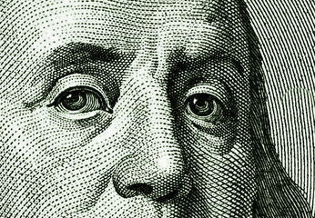 Fragment of face of Benjamin Franklin from the portrait of USA one hundred dollar note - obrazy, fototapety, plakaty