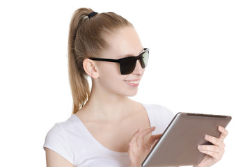 Young woman in sunglasses using a digital tablet computer