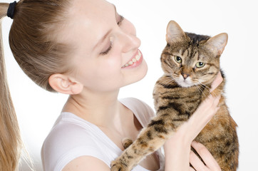 Beautiful young woman with cat
