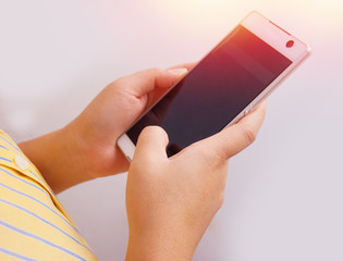 Women hand using mobile phone