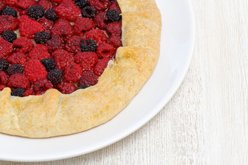 Homemade galette with red and black raspberries