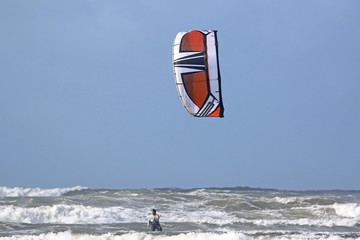 kitesurfer riding in waves
