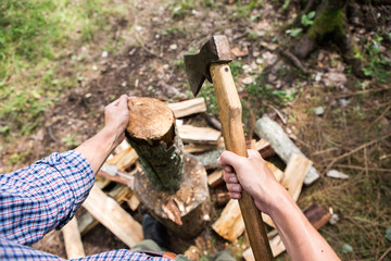 a man chopping wood in the forest