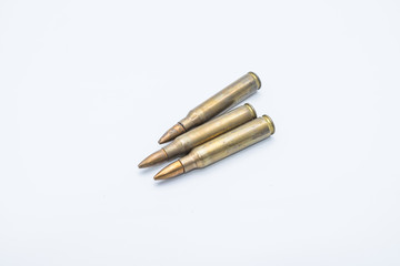 old rifle cartridges 5.56 mm on a white background