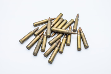 old rifle cartridges 5.56 mm on a white background