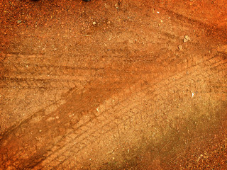 Tire tracks on the road gravel stone background